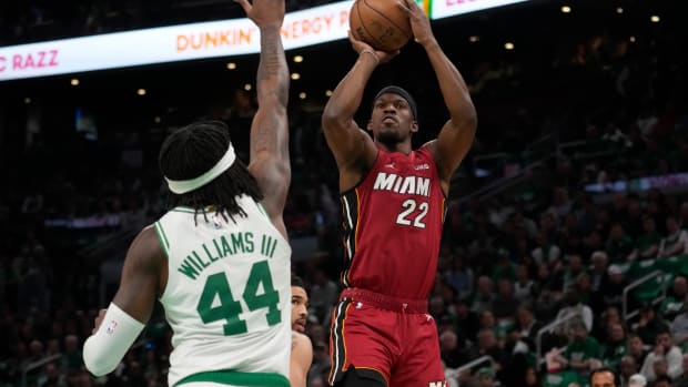 Jimmy Butler shoots against Boston Celtics center Robert Williams III in the first half.